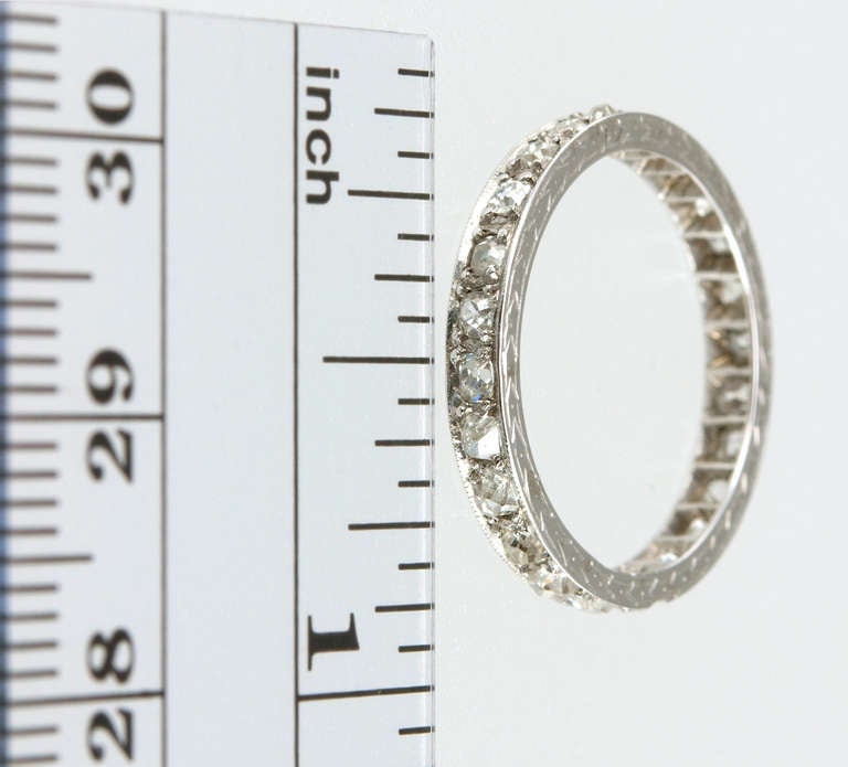 This eternity band features approximately 1 total carat of old mine cut diamonds which are prong set in platinum with millegrain detail and etched engraving- a very special band! Circa 1915.
Size 6.5 and cannot be adjusted.
