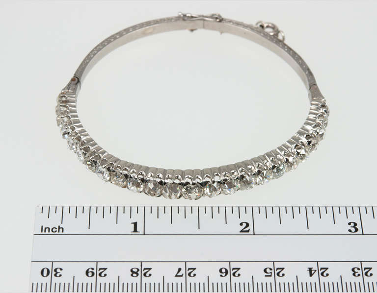 Twenty-four big, chunky Old Mine Cut diamonds- oh my! This stunning platinum bangle contains 15cts of graduated diamonds that range in color from H-K and clarity of VS1-SI1, circa 1900.
Bangle diameter is 6.75 inches.