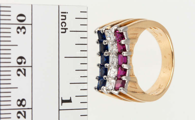 Red, white and blue is always in fashion- especially when it is made by Cartier! This retro ring features three rows of beautifully matched rubies, diamonds, and sapphires, totaling 3 carats, prong set in platinum and 18 karat yellow gold, circa