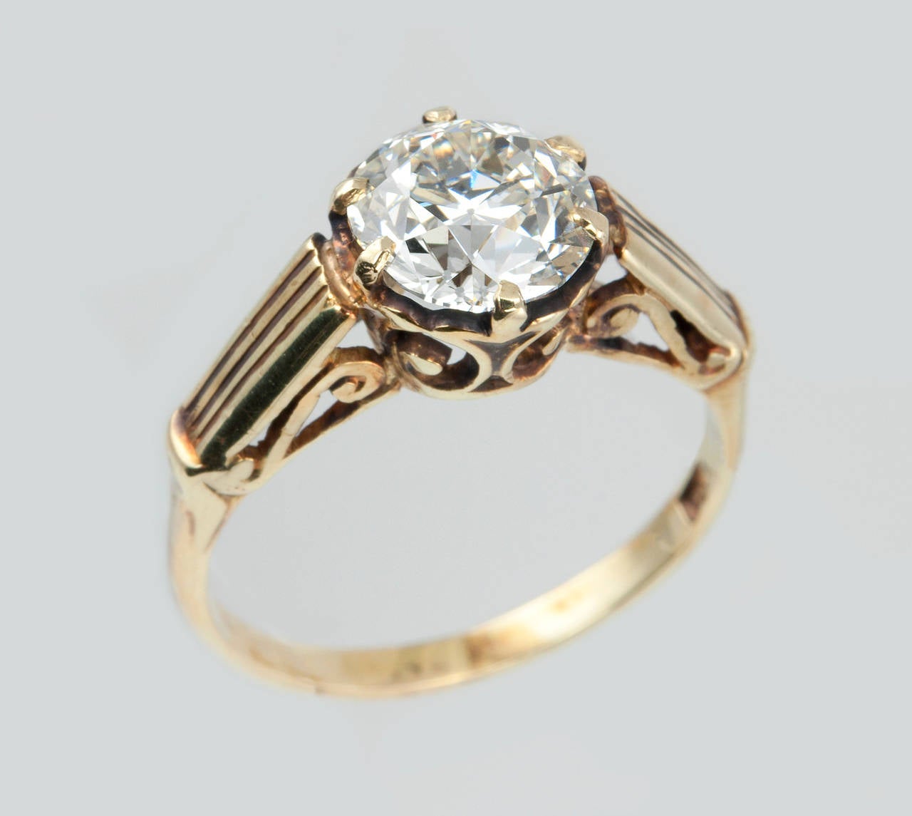 This Victorian engagement ring features a beautiful Old European Cut 1.60 carat H-VS1 diamond that sparkles in the simple solitaire mounting in 14 karat yellow gold. Circa 1900. 

Currently a US size 6.75 and easily adjustable.
EGL certificate.