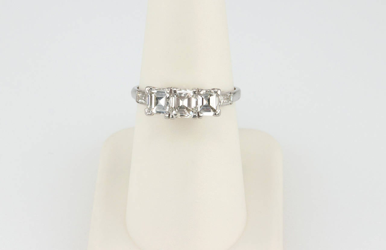 Women's Art Deco Square Emerald Cut Diamond Platinum Three Stone Ring For Sale