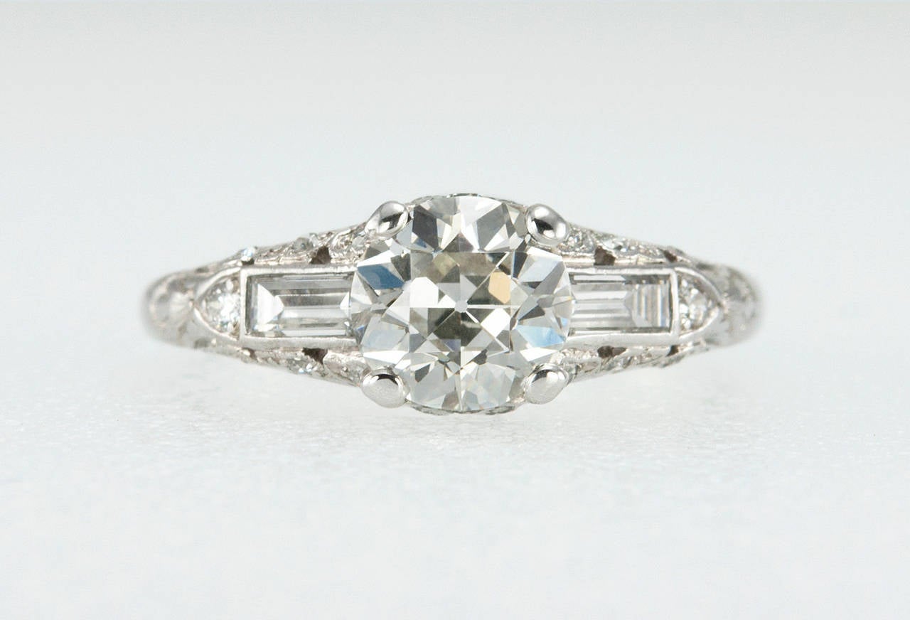 A gorgeous Art Deco platinum ring featuring a 1.18 carat Old European Cut diamond center that is I in color and VS1 in clarity (EGL certificate) with an additional 22 diamonds mounted around the center to give an overall sparkle to this beautiful