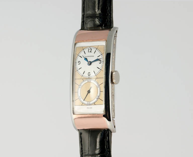 Longines 14k rose and white gold rectanglular Doctor's wristwatch, manual-wind 17-jewel movement. Triple-signed. Dial has been refinished. Circa 1937. 19.5mm wide by 42mm long.

This watch includes a one year warranty from the time of purchase for