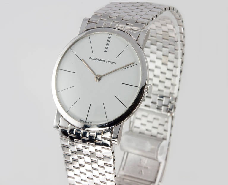 Audemars Piquet 18k white gold ultra-thin wristwatch with original white 
gold brick Audamars Piquet bracelet measuring 7 inches long. 32mm case with white dial and mechanical movement. Watch is wonderful condition. Circa 1960s.

This watch