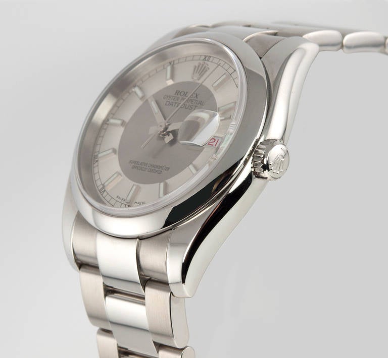Rolex stainless steel Datejust wristwatch, Ref. 116200, with steel Oyster bracelet, 36 mm case. Watch features a magnified date, two-tone silvered dial with baton markers, a 31 jewel movement, with a scratch-resistant crystal and locking screw-down