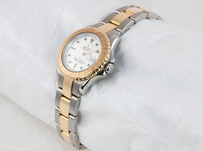 Rolex Lady's Stainless Steel and 18k Yelllow Gold Yachtmaster Wristwatch,  2001. This classic Rolex has an automatic movement and has a scratch-resistant sapphire crystal, waterproof screw-down crown, a stainless steel
and 18k gold Oyster bracelet,