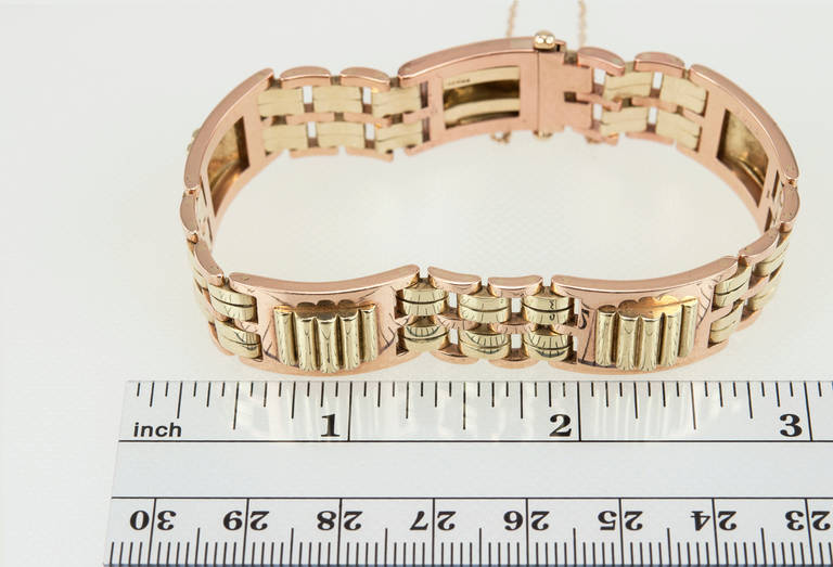 A super chic Cartier Retro link bracelet in 14 karat rose gold and yellow gold from c1950. The bracelet is just over a half an inch in width and when the clasped is closed is approximately 6.75 inches in diameter. A classic piece that you will never