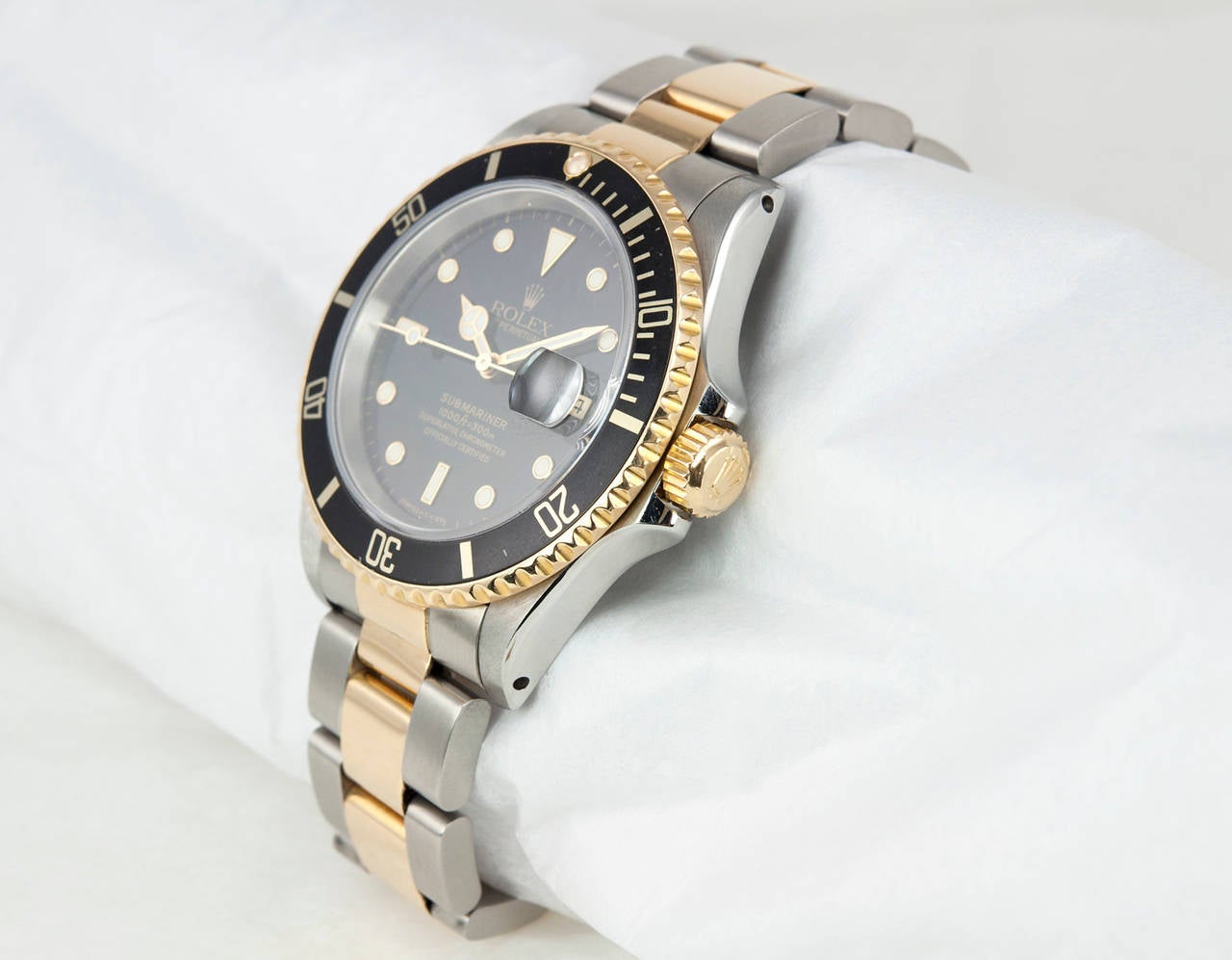 Rolex stainless steel and 18k yellow gold Submariner wristwatch, Ref. 16613, circa 1992. Automatic movement with date, waterproof screw-down crown, unidirectional revolving bezel, scratch-resistant sapphire crystal, black dial and bezel. Case