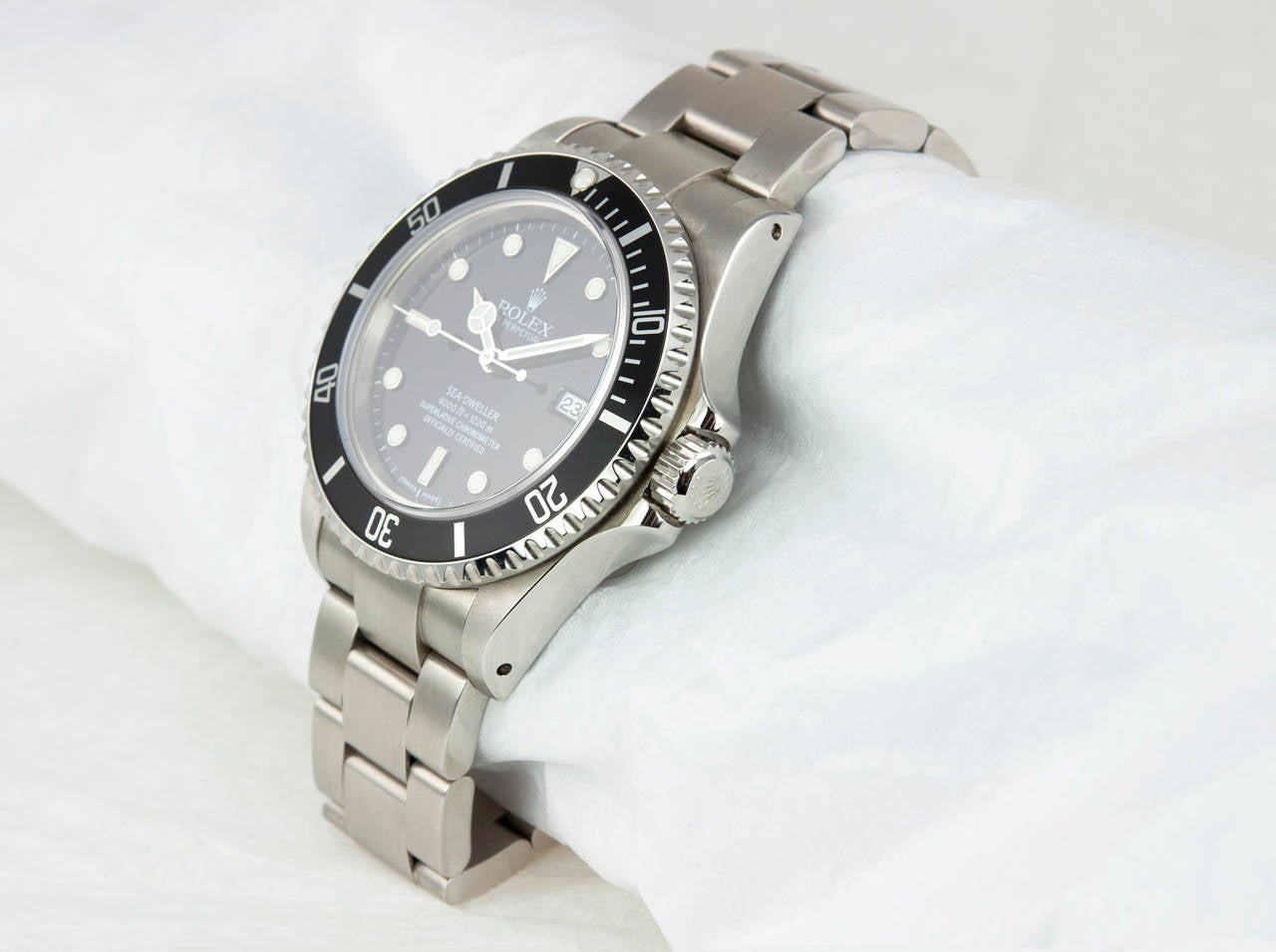 Rolex stainless steel Sea-Dweller wristwatch, Ref. 16600, 2000. This watch features a helium escape valve, a black dial with luminescent hour markers, automatic movement with date, scratch-resistant sapphire crystal, waterproof screw-down crown.