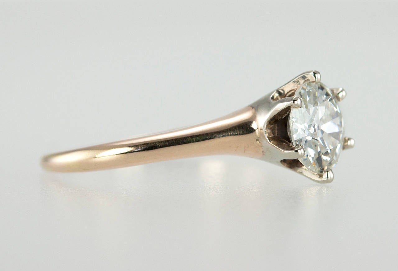 Classic, simple, and elegant 1.03ct I-VS1Old European cut diamond solitaire ring from c1910s. The diamond is set in a five prong setting in 14 karat topped platinum, which was a common practice for the time period. The gold color is slightly pink