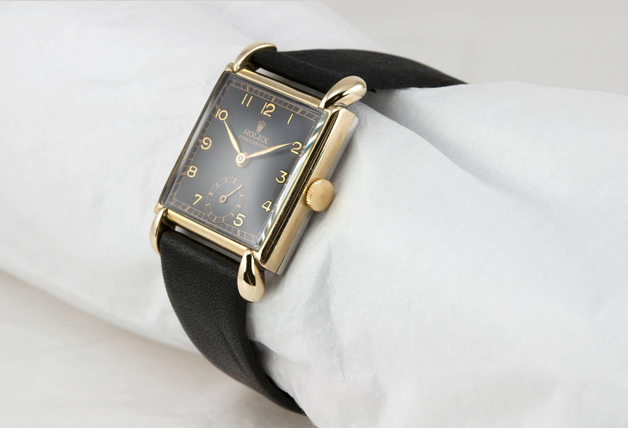 Rolex yellow gold and stainless steel square wristwatch, Ref. 4578. The back of this watch is stainless steel with a yellow gold top. The black dial on this watch is refinished. Manual-wind movement, 17 jewels. Circa 1947. Case measures