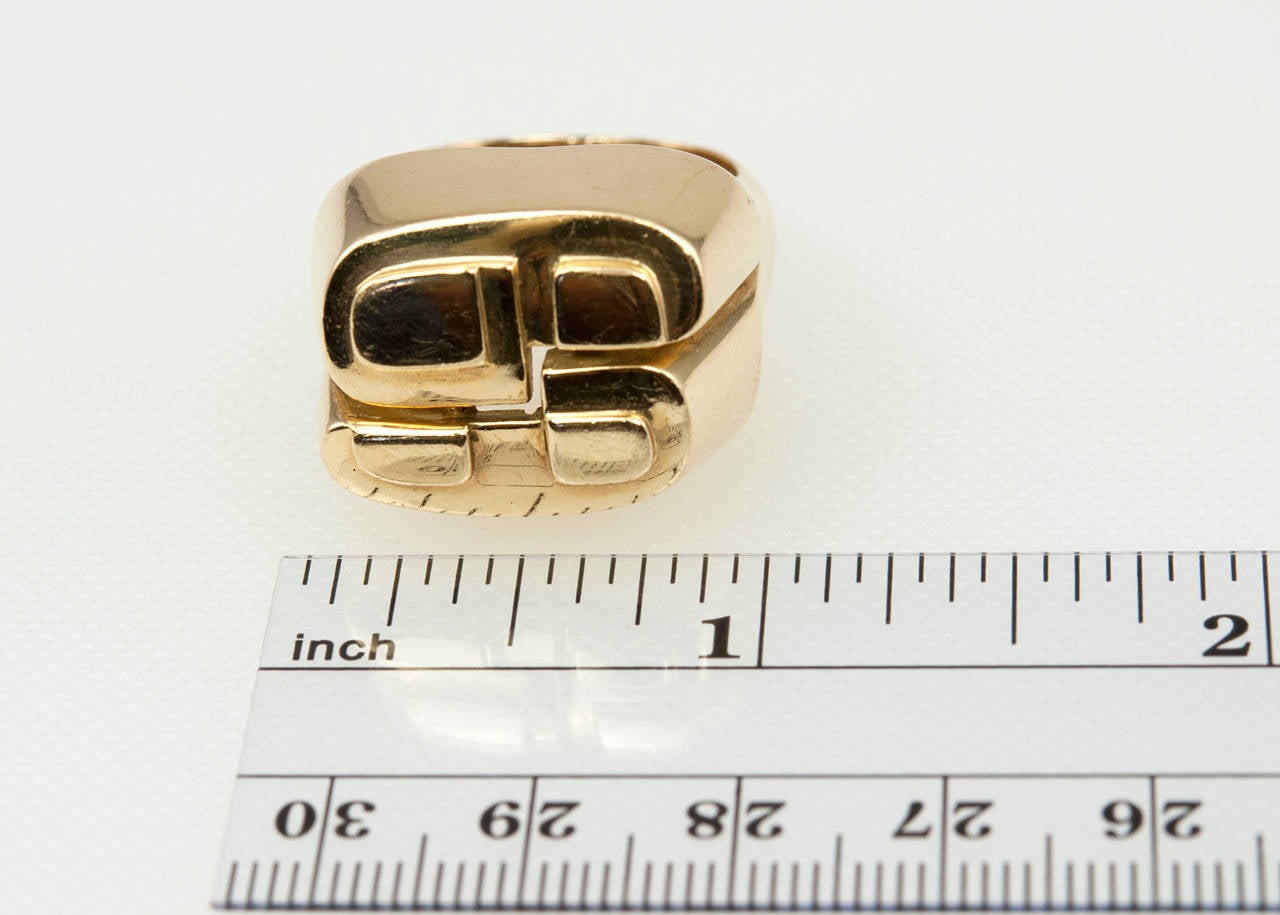 A cool and chunky David Webb ring in an abstract, geometric design in 18 karat yellow gold, circa 1970s. 

Currently a US size 8.5 and easily adjustable.