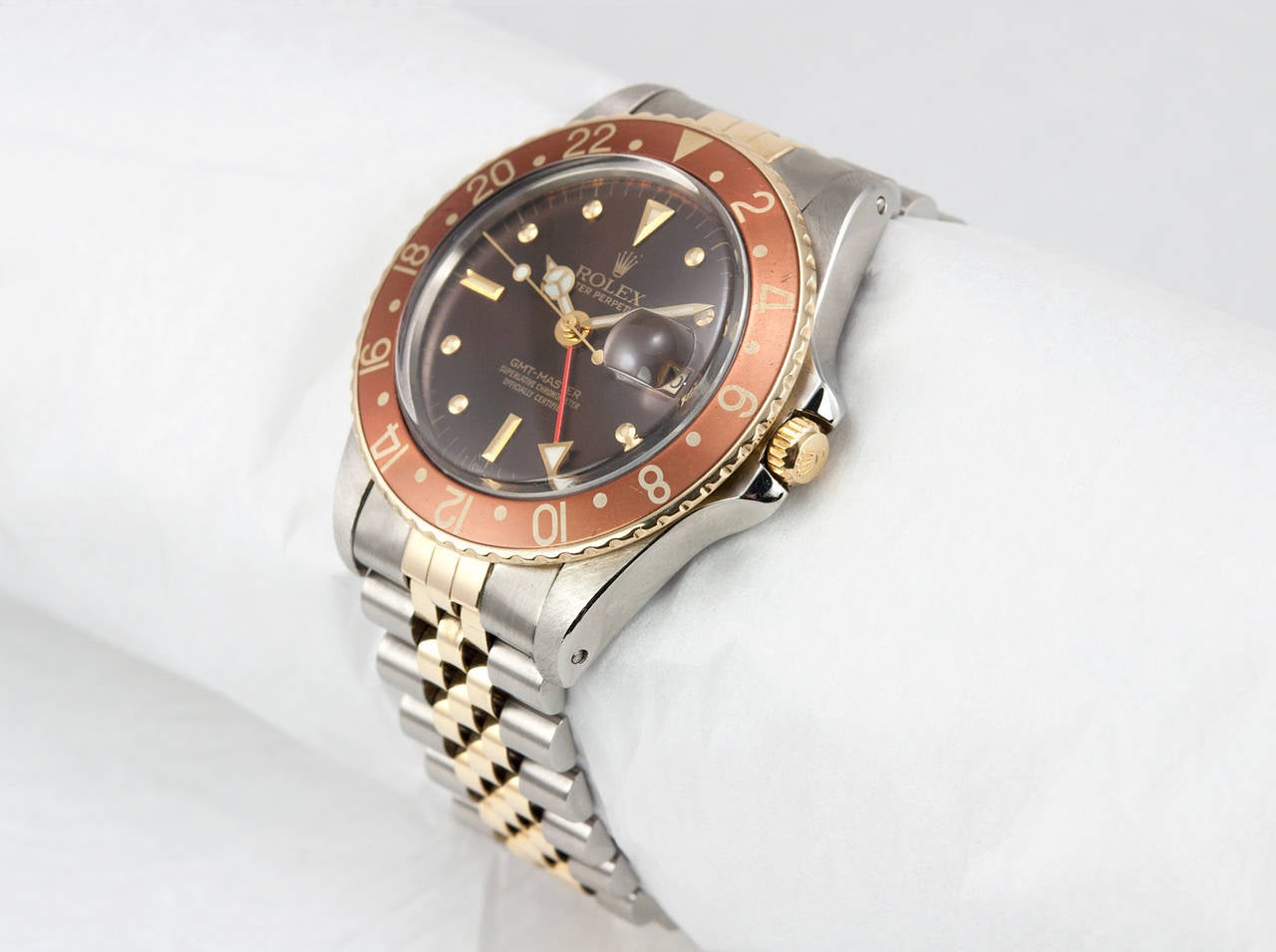 Rolex Stainless Steel and 14k Yellow Gold GMT-Master Wristwatch, Ref. 16753,  1982. This classic watch has a brown 