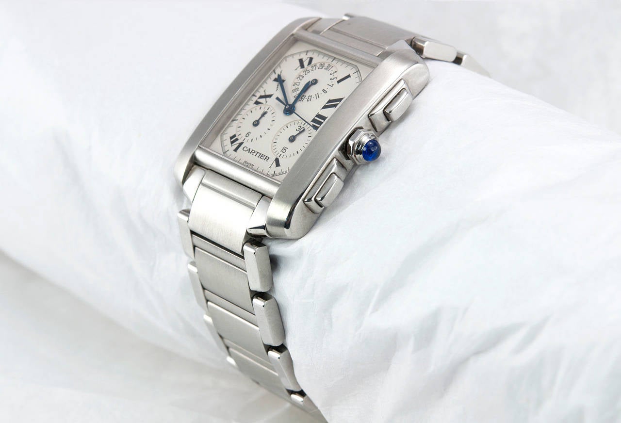 Cartier Tank Francaise Chronoflex wristwatch, reference W51024Q3. This watch features a silver grained dial, fixed bezel, roman numeral hour markers, sword-shaped steel hands, sapphire crystal, and a stainless steel bracelet. The watch also features