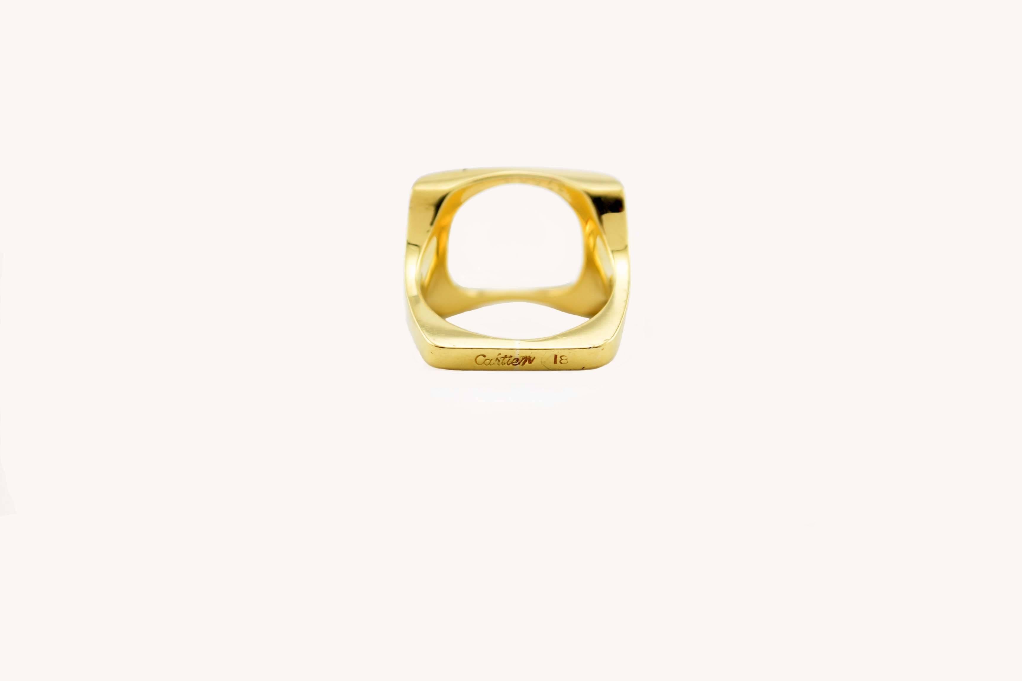 A very collectible Cartier Dinh Van circle in a square gold ring in 18 karat yellow, circa 1970.

The ring is approximately 0.55 inches in height.
Currently a US size 5.5 and not sizeable.