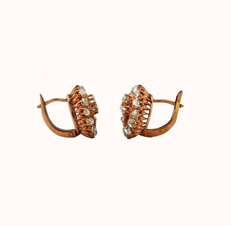 Victorian Old Mine Cut diamond earrings in 18 karat rose gold from circa 1880s. These beautiful lever-back earrings feature 34 Old Mine Cut diamonds and 2 rose cut diamonds, for a total diamond weight of 1.80 carats.  Gorgeous and easy to wear for