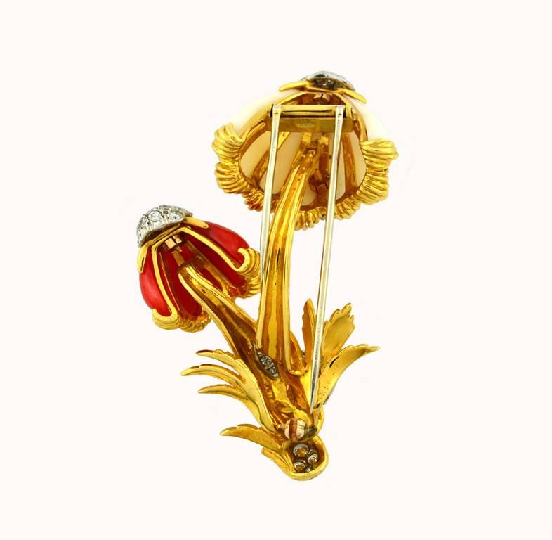 Van Cleef & Arpels mushroom brooch in 18 karat yellow gold.  This incredible brooch features a red and white coral in the shape of mushrooms with diamond accents. Circa 1960.

This brooch measures approximately 2.67 inches in height and 1.63