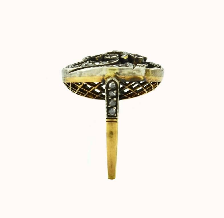 Victorian silver topped 18 karat yellow ring from circa 1890.  A very cool and interesting ring featuring 7 old cut rubies and 60 rose cut diamonds.

Currently a US size 6.75 and easily adjustable.

This ring measures approximately 0.87" in