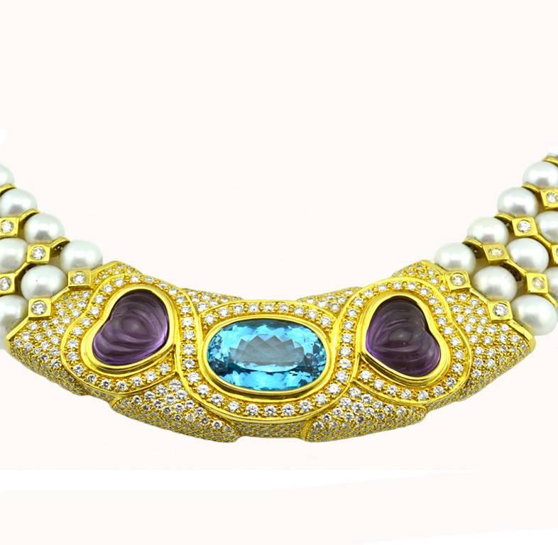 A pearl collar/choker necklace in 18 karat yellow gold from circa the 1980s.  This necklace features three rows of pearls with round brilliant diamonds set throughout the necklace for approximately 15 carats in total diamond weight.  A 35 carat