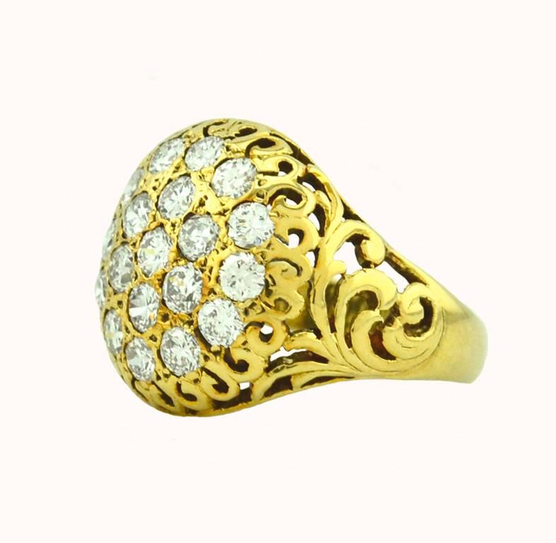 A fantastic diamond cluster ring in 14 karat yellow gold from circa the 1940s.  This ring features 19 transitional cut round diamonds that are H-I in color and VS-SI in clarity for an approximate total diamond weight of 2 carats.  

Currently a US