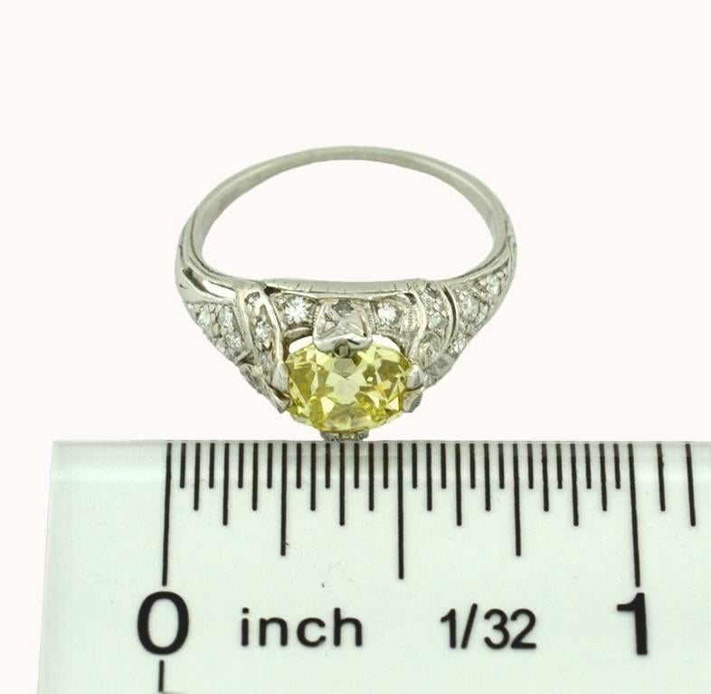 Women's 1.61 Carat GIA Natural Fancy Yellow Old Mine Cut Diamond and Platinum Ring For Sale