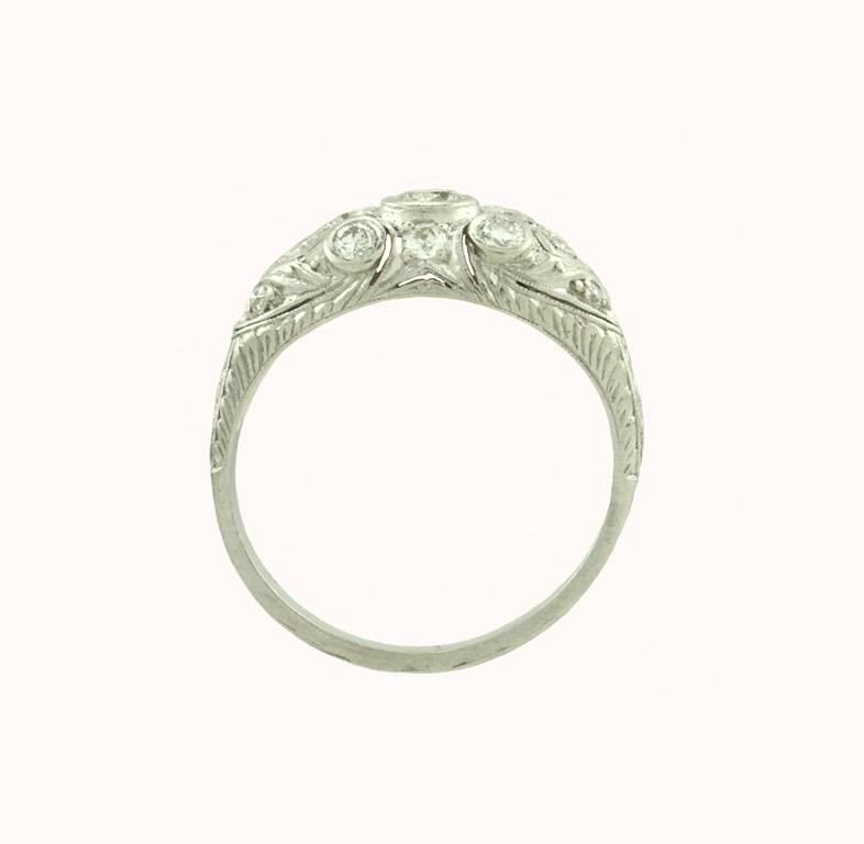 Art Deco diamond and platinum engagement ring from circa 1930.  This pretty ring features 15 Old European Cut diamonds that are I-J in color and VS in clarity, which total approximately 0.90 carats in diamond weight.  A very sparkly ring and very