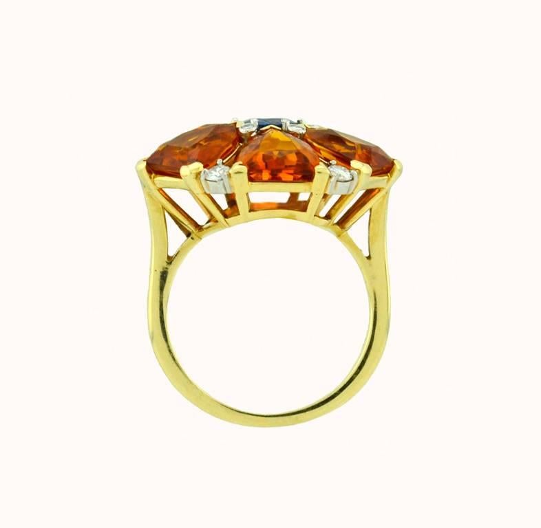 Super Chic fancy cut citrine ring with a blue Sapphire center approximately 0.60cts, and 12 diamonds 0.35cts. In 14k yellow gold. Circa 1990,  Size 8 and easily altered. 

