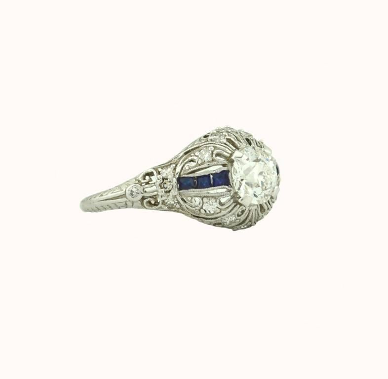 Women's Art Deco 0.66 Carat Old Cut Diamond and Sapphire Platinum Engagement Ring For Sale