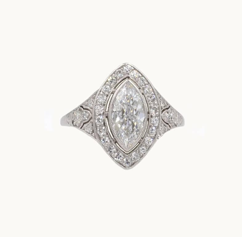 A stunning marquise diamond and platinum engagement ring from circa 1930.  This beautiful ring features a 0.94 carat Golconda Type IIA center diamond that is D-E in color and VS1 in clarity (per EGL certificate). An additional 30 round brilliant