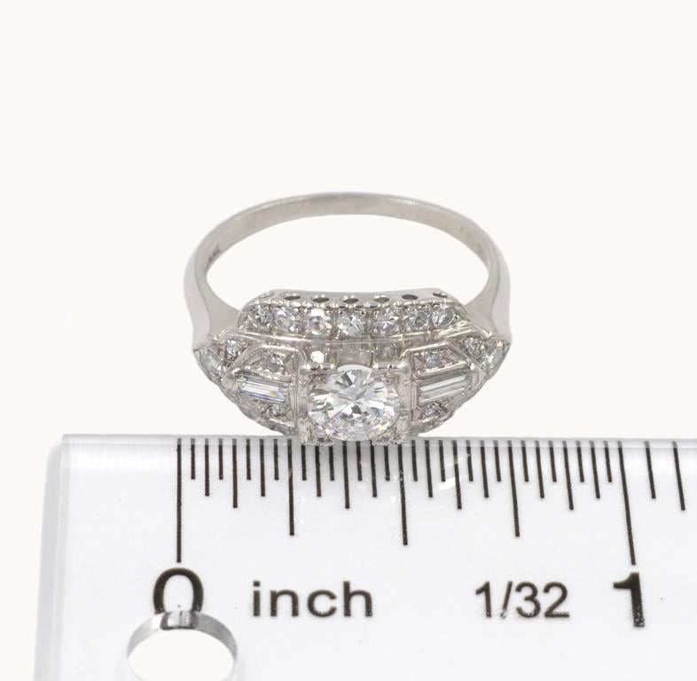 Round Cut Vintage 1950s 0.46 Carat Diamond Center and Platinum Engagement Ring For Sale
