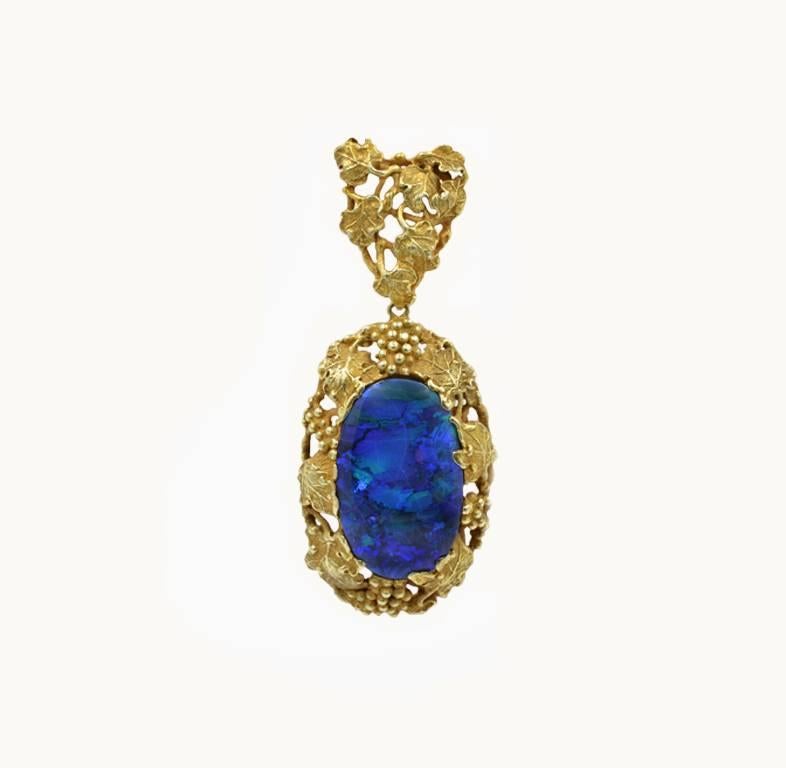 Walton & Co. Black Opal pendant surrounded by grapes and leaves. 14ky yellow gold, Art Nouveau, circa 1900.  AGL certificate, natural untreated Australian Opal.  
The opal is 22x16mm, the drop on the chain is 18 inches.  The pendant is 2 1/2 inches