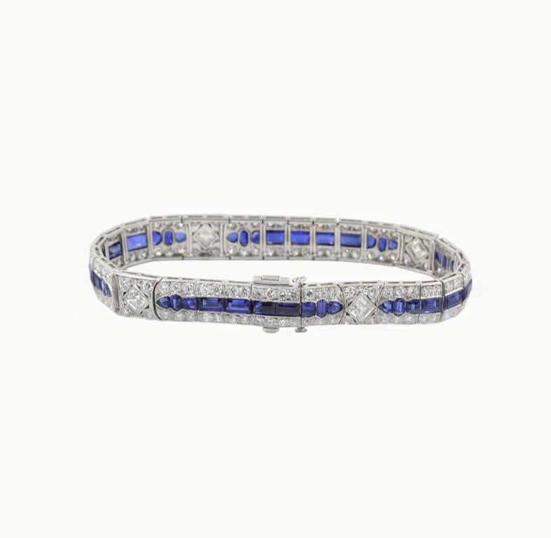 A Tiffany & Co antique Art Deco diamond and sapphire platinum link bracelet from circa 1920s.  This stunning bracelet features four square diamonds and 132 Old European Cut diamonds that total approximately 11 carats in total diamond weight. Forty