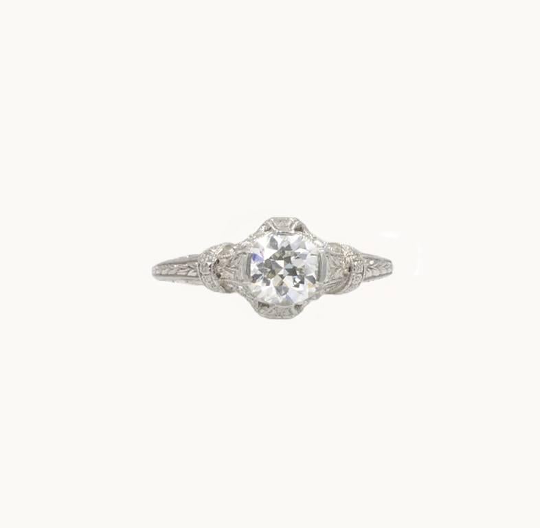 An beautiful Edwardian diamond and platinum engagement ring fro circa 1915-1920.  This ring features a 0.81 carat Old European Cut diamond that is F in color and VS2 in clarity (per EGL certificate).  Four round side diamonds, each approximately