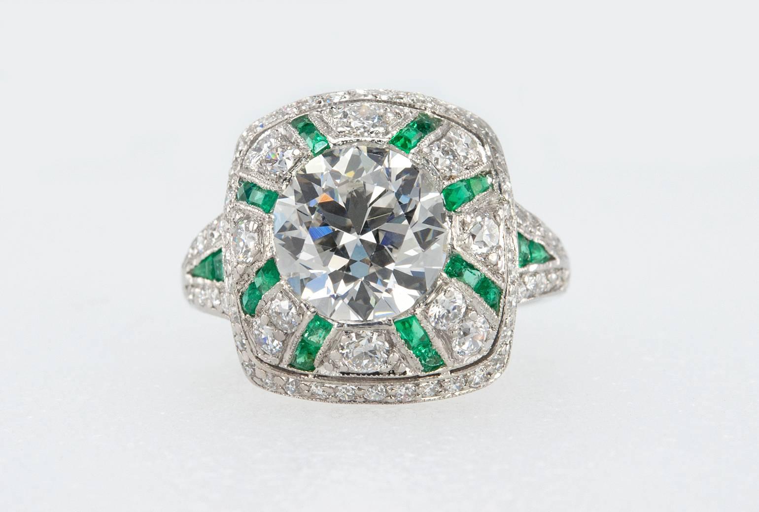 Tiffany & Co. at it's best! This Edwardian platinum ring features bezel set Old European Cut diamond that is approximately 2.50 carats and is a G in color and VS1 in clarity.  The incredible domed mounting is set with diamonds and calibre cut