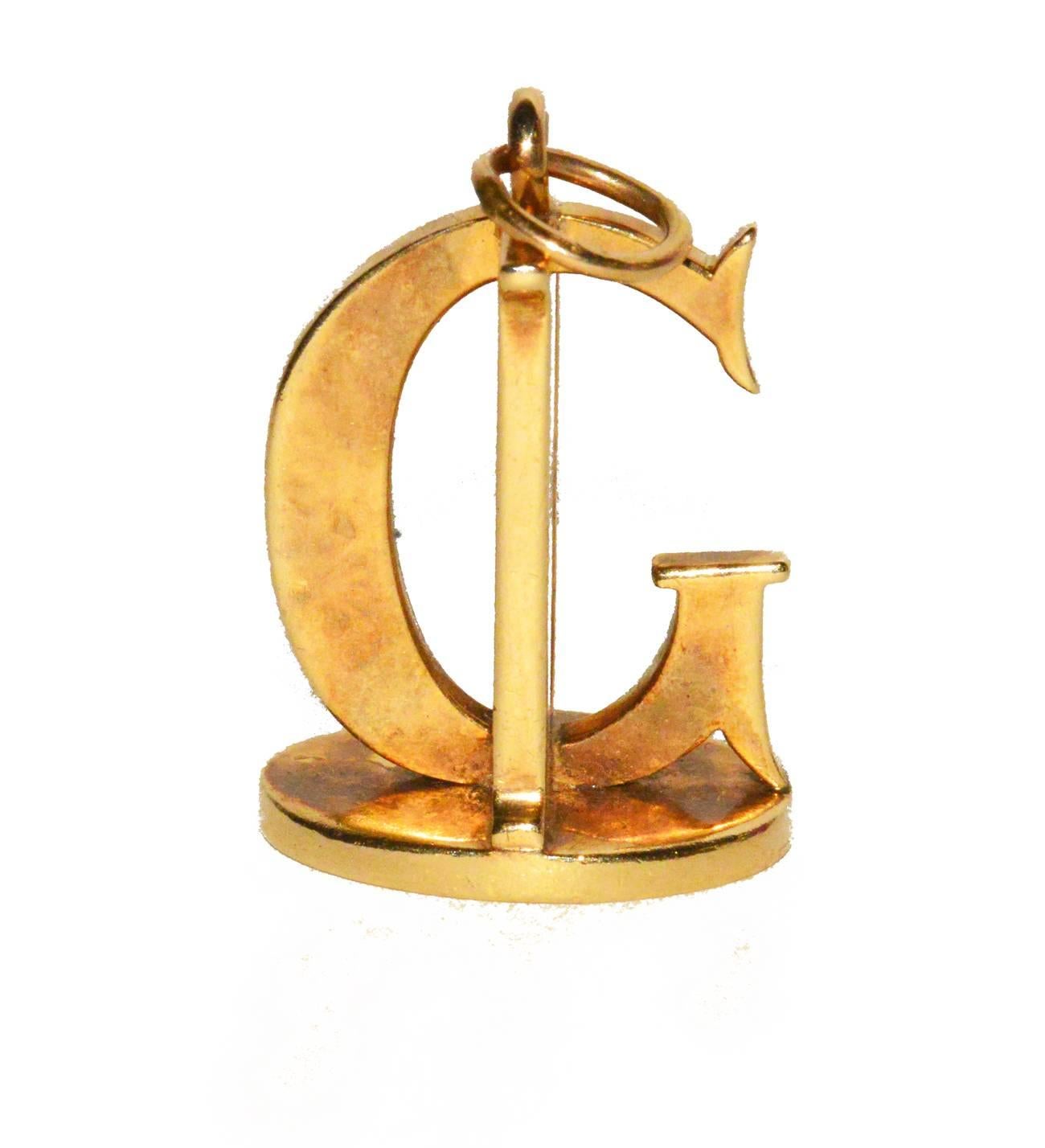 Great Tiffany pendant with the letters G and D...Large...circa 1940s from Gem de la Gem and is in excellent condition.