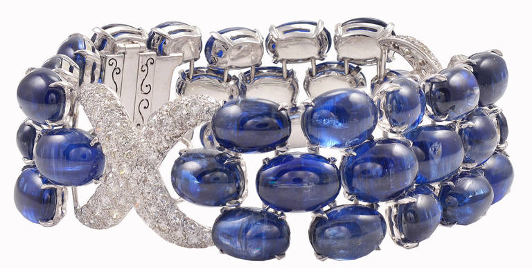 Gorgeous estate 40 stone natural cabochon sapphire and diamond bracelet.  Approximately 80 cts of sapphires and 4.70 cts diamonds. 18K white gold...easily fits 6.75-7.25