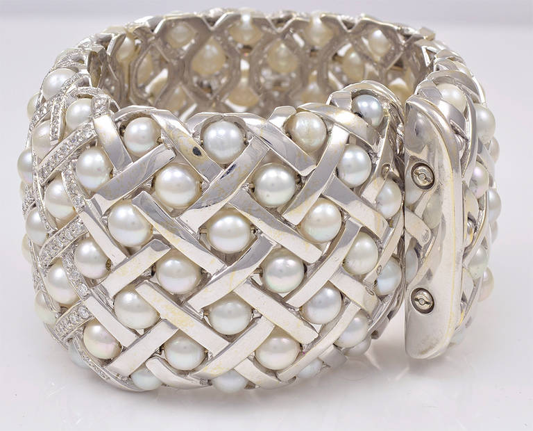 Magnificent and majestic extra wide 18K white gold, pearl and approximately 5 cts of diamond cuff bracelet.  1.5
