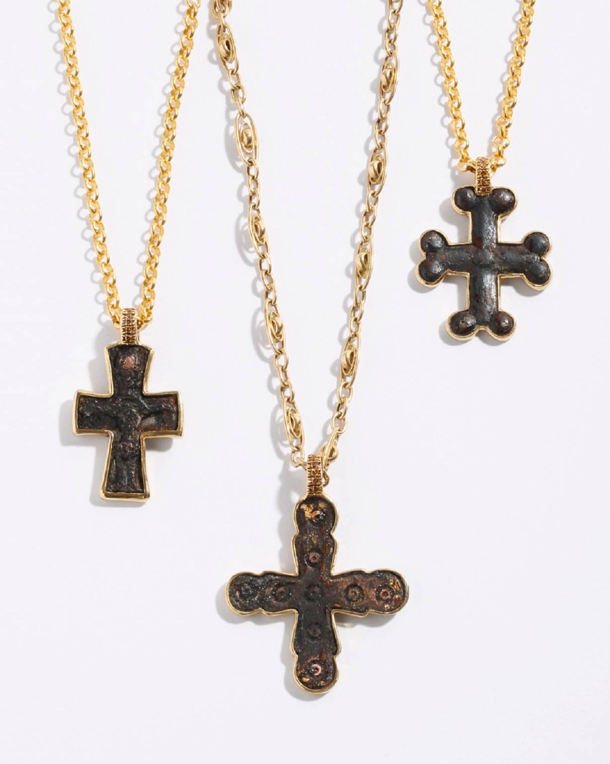 9th Century A.D. Bronze cross framed in 22K Yellow Gold with six stones 0.6ct cognac colored diamonds on an 18 inch 24K Yellow Gold satellite fancy link chain. Certificate of Authentication available.