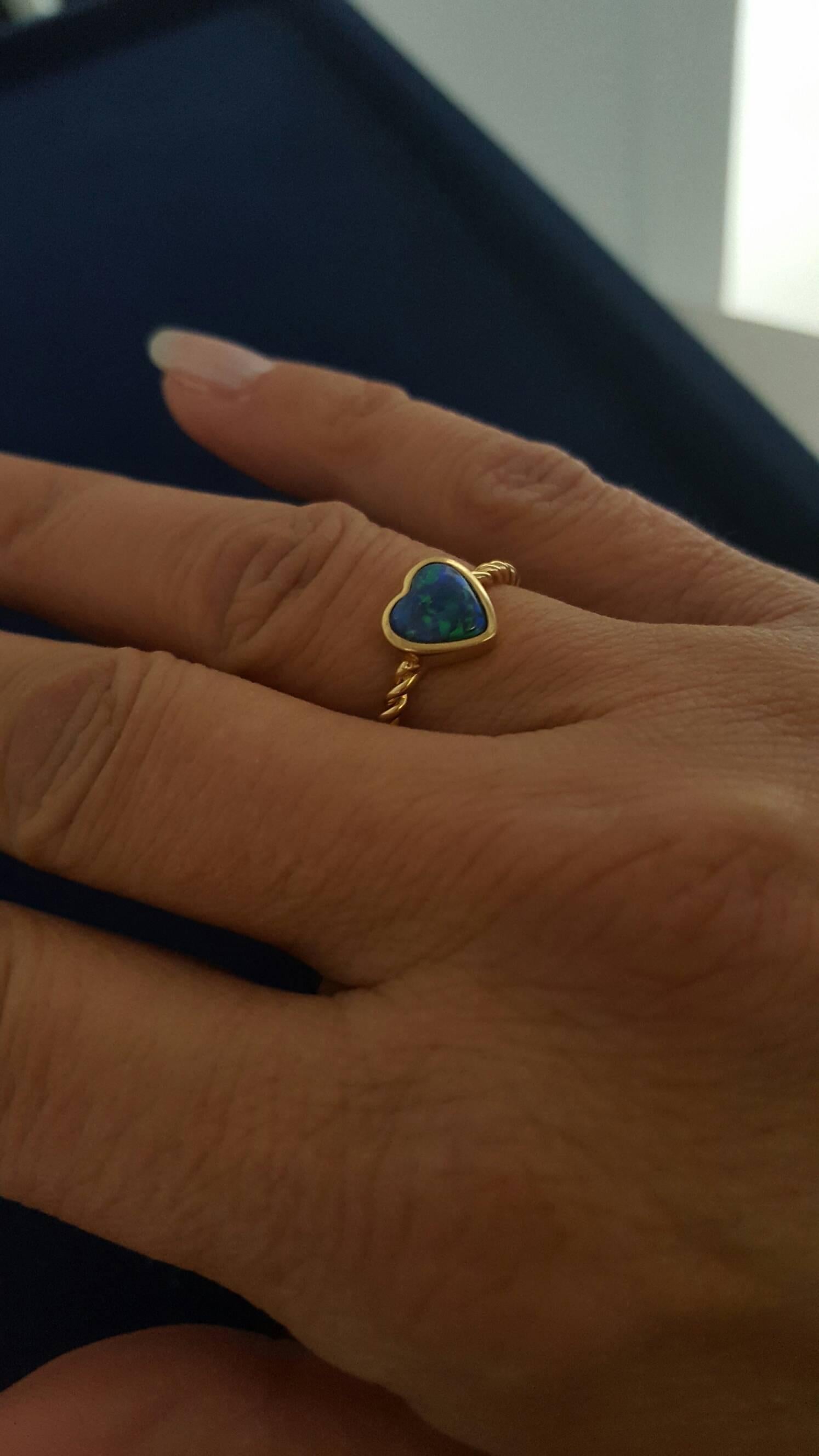 This sweet and dainty Heart Ring is perfect for everyday wear. Hand-carved 0.78ct Opal heart bezel set in 18K Yellow Gold. Ring size US 5.5.