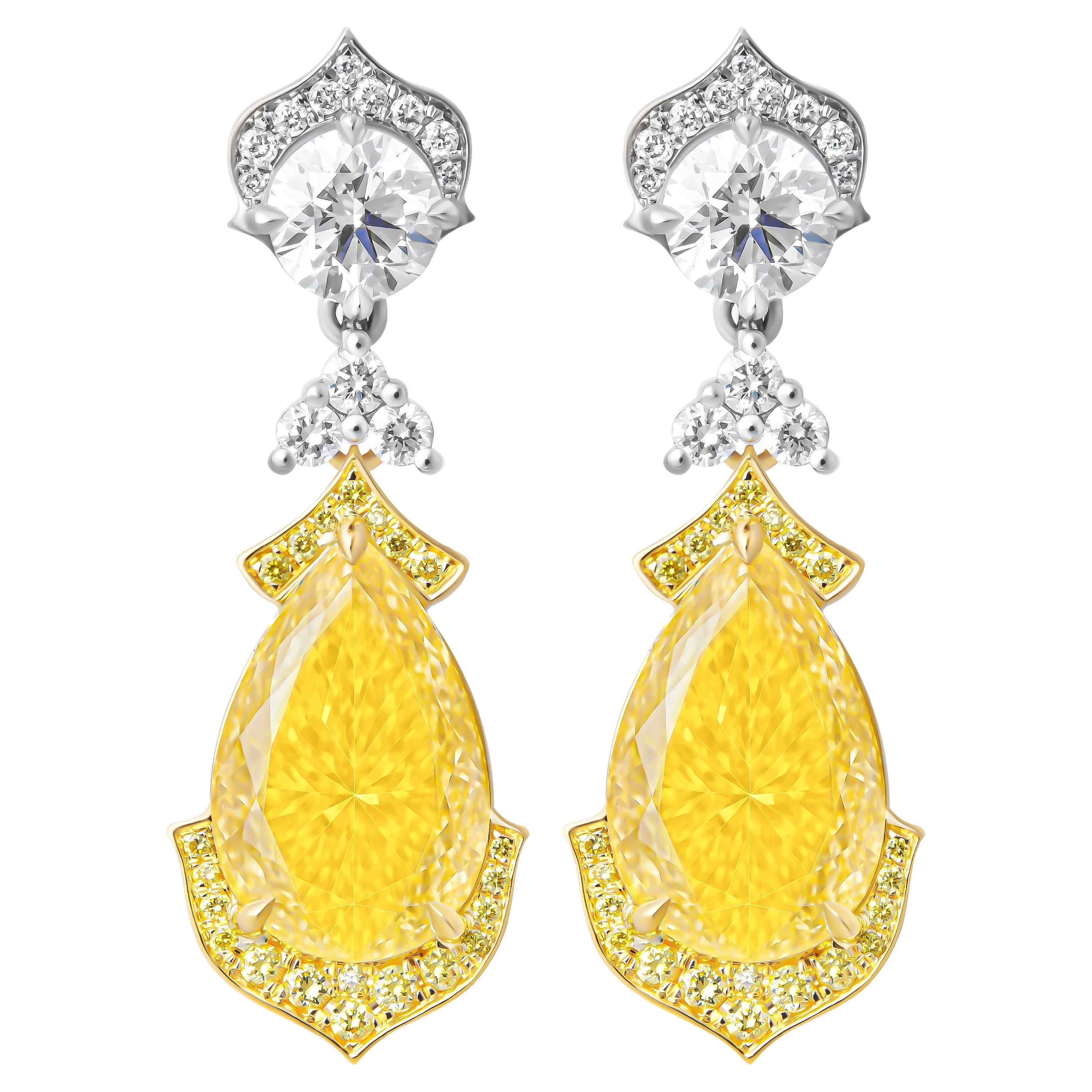 Orecchini pendenti in platino e oro 18 carati con diamanti giallo chiaro a forma di pera