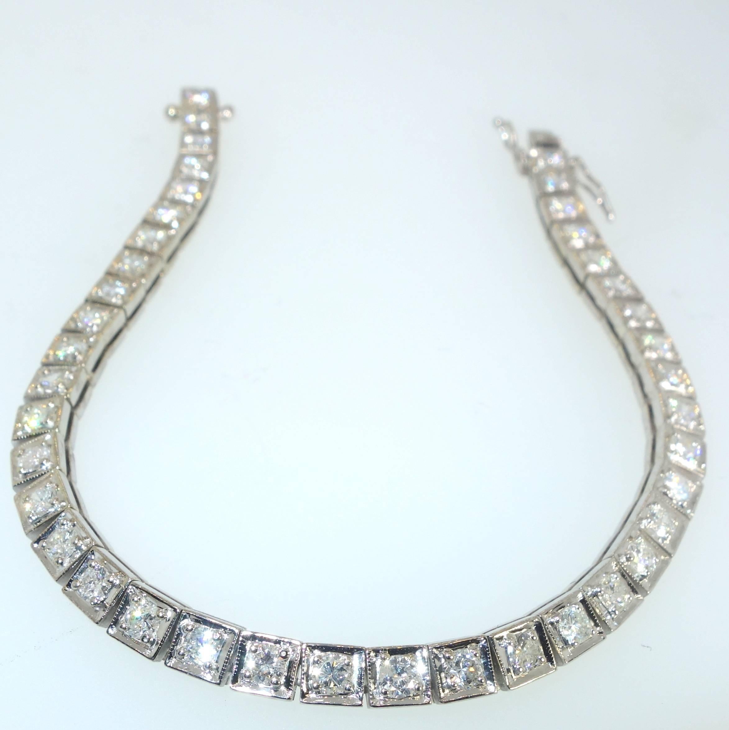 40 well matched round brilliant cut diamonds - all near colorless and slightly included are set in 18K white gold.  This 7 1/2 inch bracelet is in fine condition and was made in the mid 20th century (1950). 3.6 cts. of diamonds.