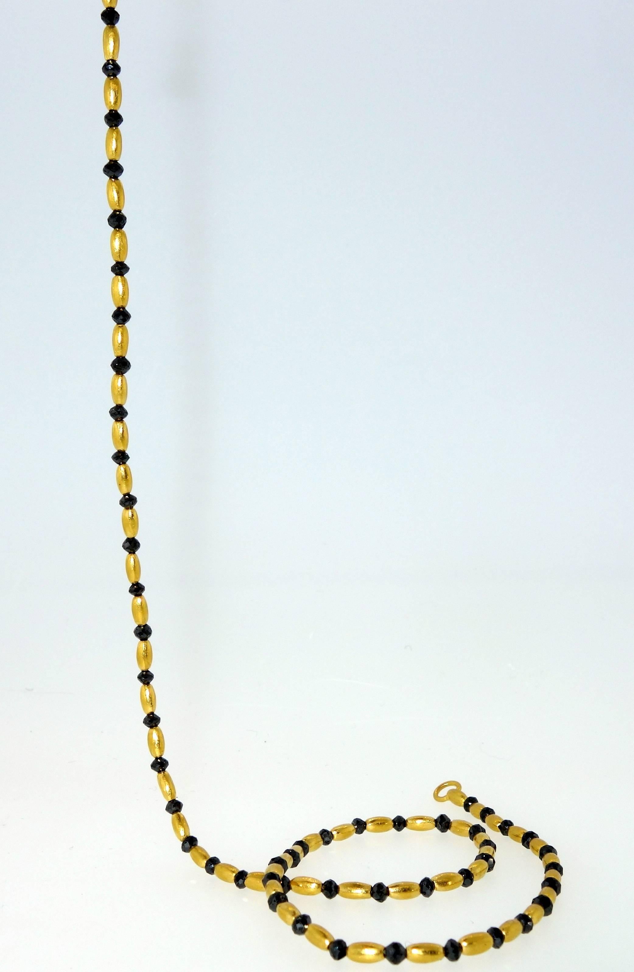 .99 % pure gold necklace interspersed with 62 faceted black diamonds amounting to approximately 6.25 cts.  This necklace is 17.3/4 inches long and weighing 12.07 grams.  This necklace is available at the Gurhan Boutique in NYC at about triple our