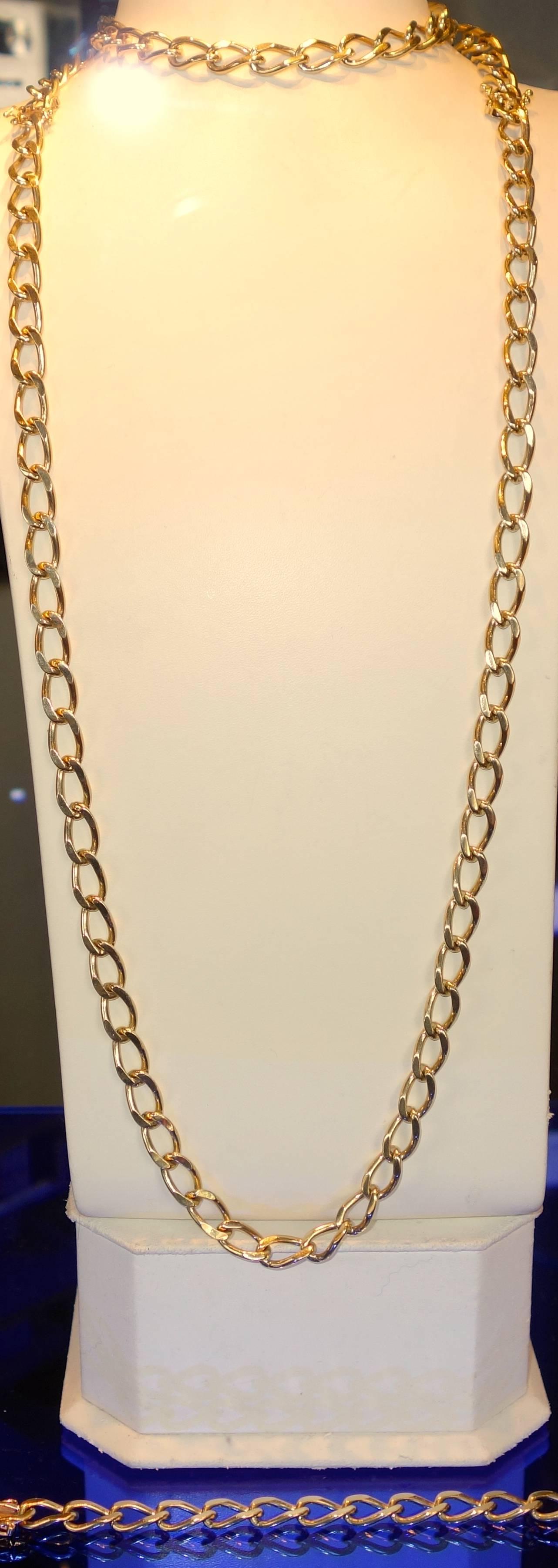 Over 61 inches long and weighing 251.35 grams (8.08 try ounces).  This long gold chain separates so that one can wear a bracelet and two shorter chains.  Very versatile with a Chanel-like look, this chain can be worn on many occasions and with just