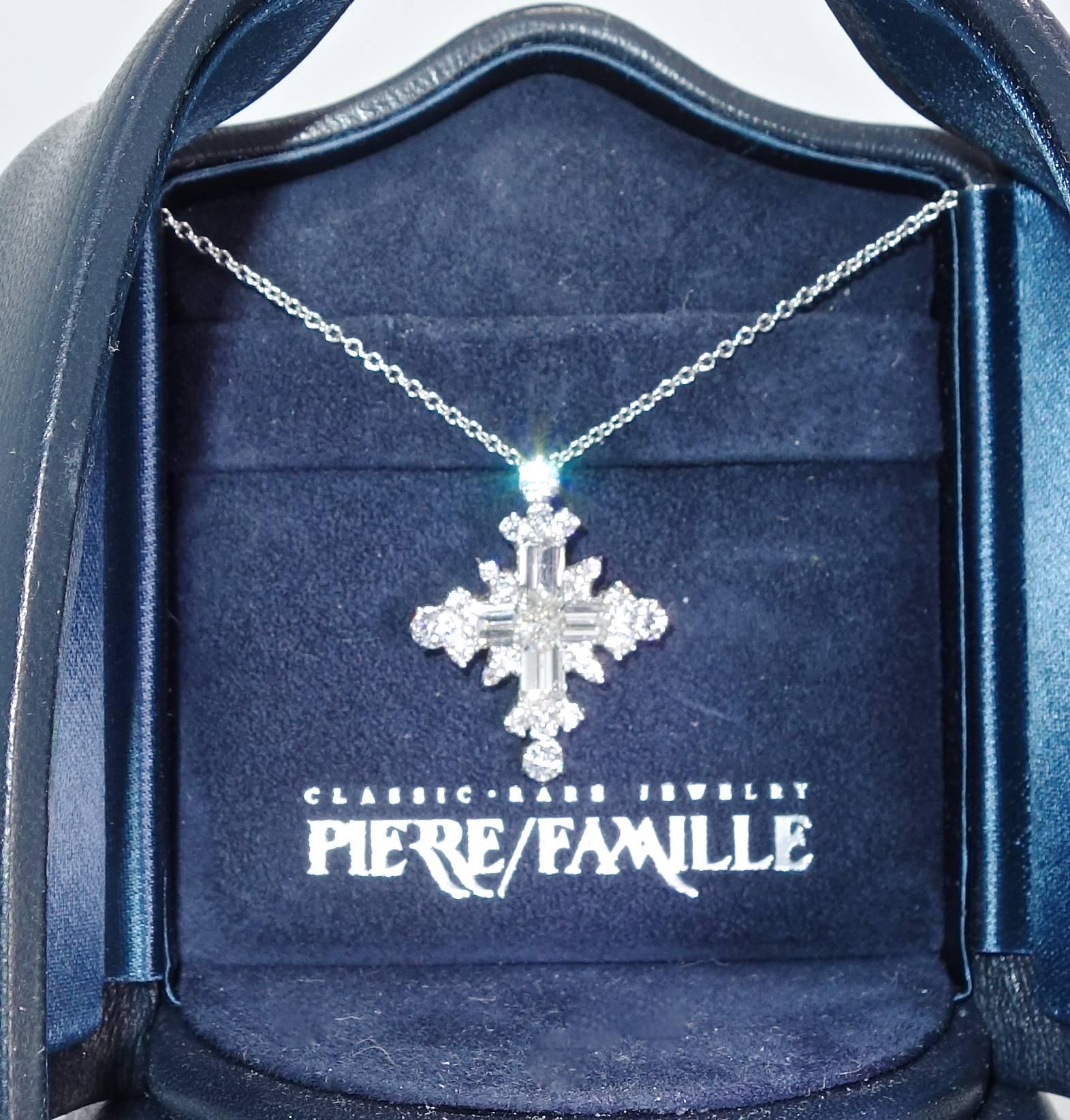 Hand made by Pierre/Famille, in platinum with fancy cut fine diamonds, approximately 3 cts., this necklace is well made, unusual with fine F/G color diamonds (colorless to near colorless) and VVS (very very slightly included) clarity.  Suspended