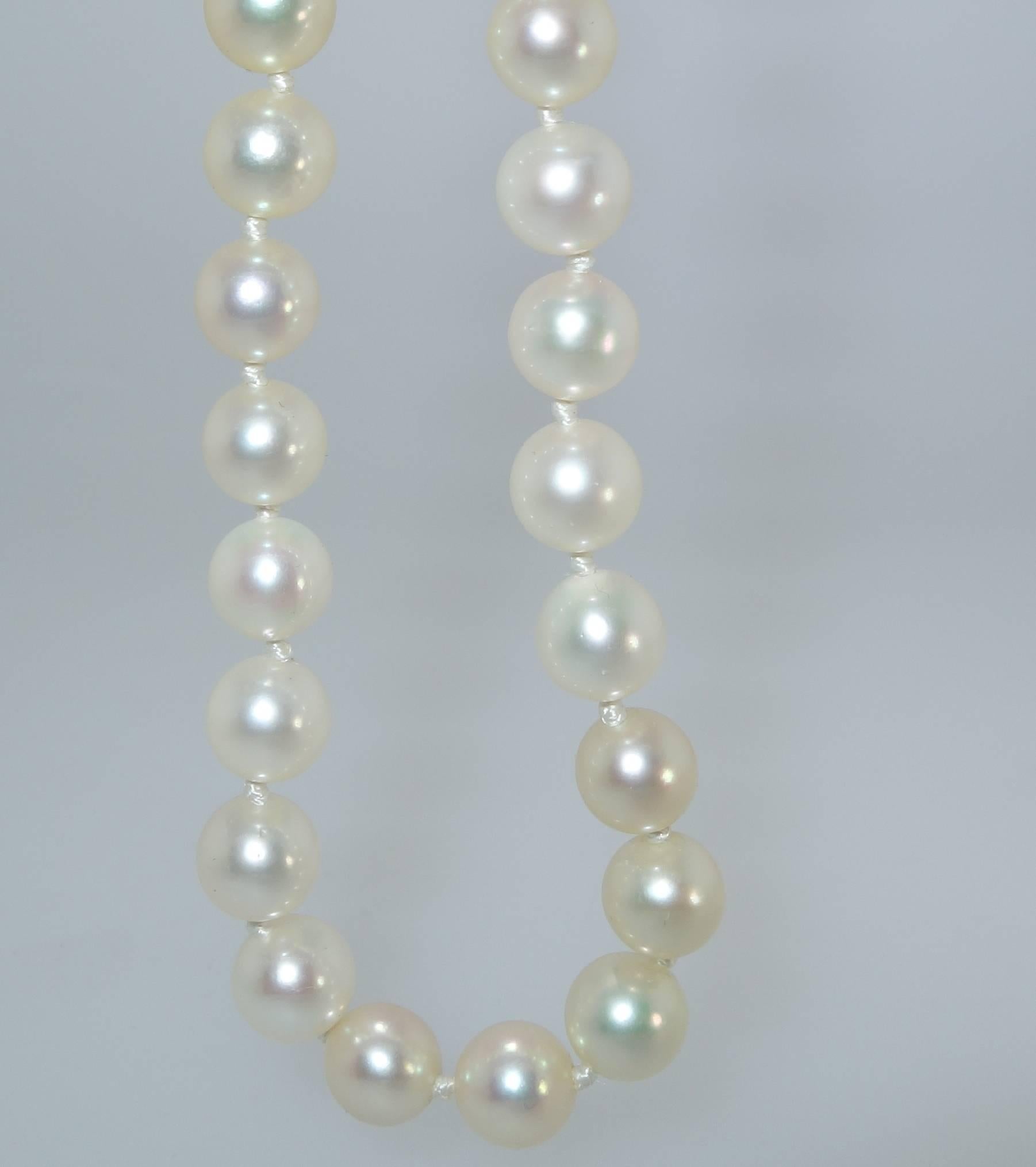 The 18K white gold clasp with small diamonds complete this 25 inch strand of fine cultured pearls ranging in size from 6.5 to 7.0 mm.  There are 78 round pearls which all display a fine depth of nacre which is why the pearls are so reflective and