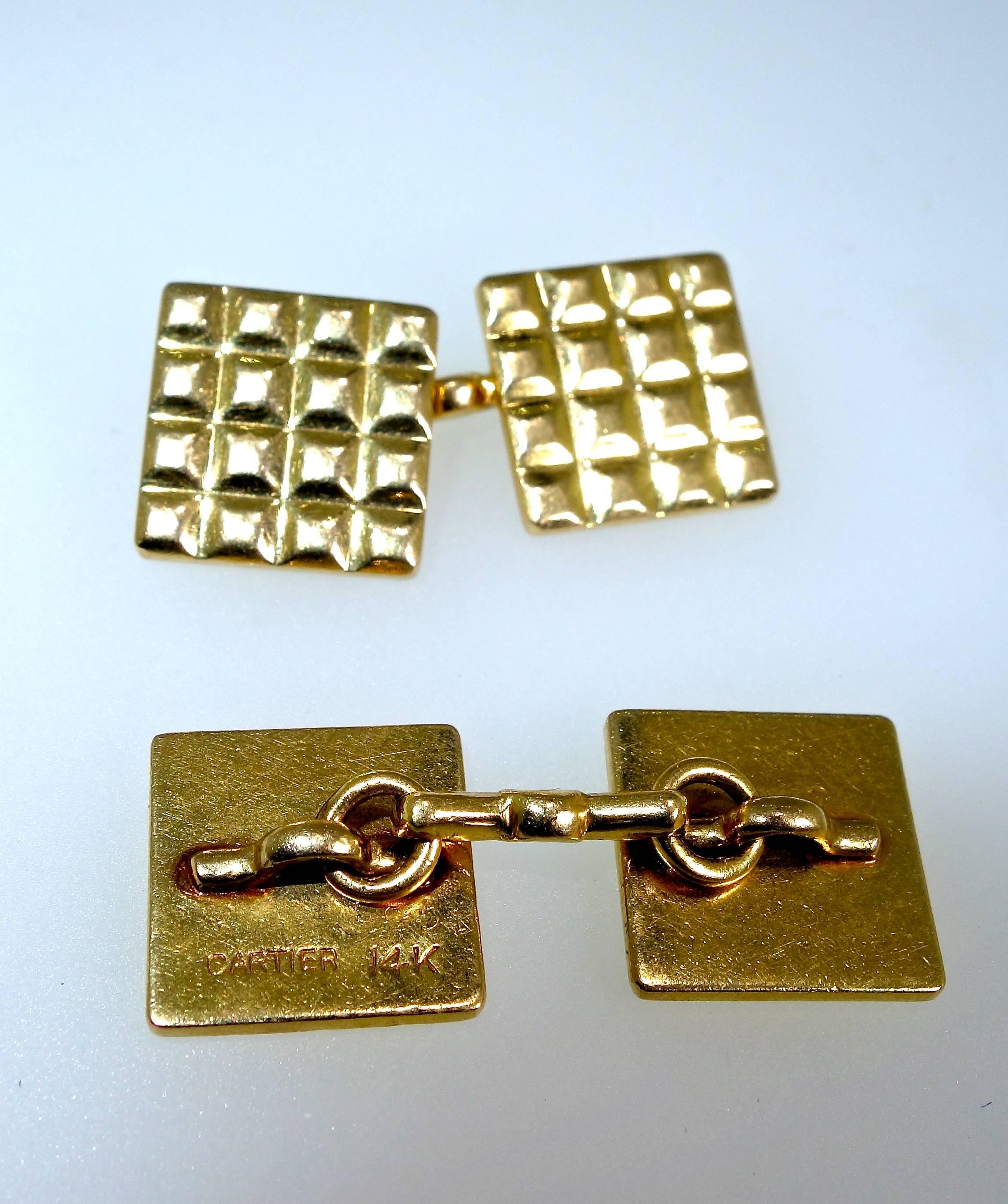 These back to back gold cufflinks are .50 inches square and weigh 10.07 grams.  They are a classic look and well made by Cartier.