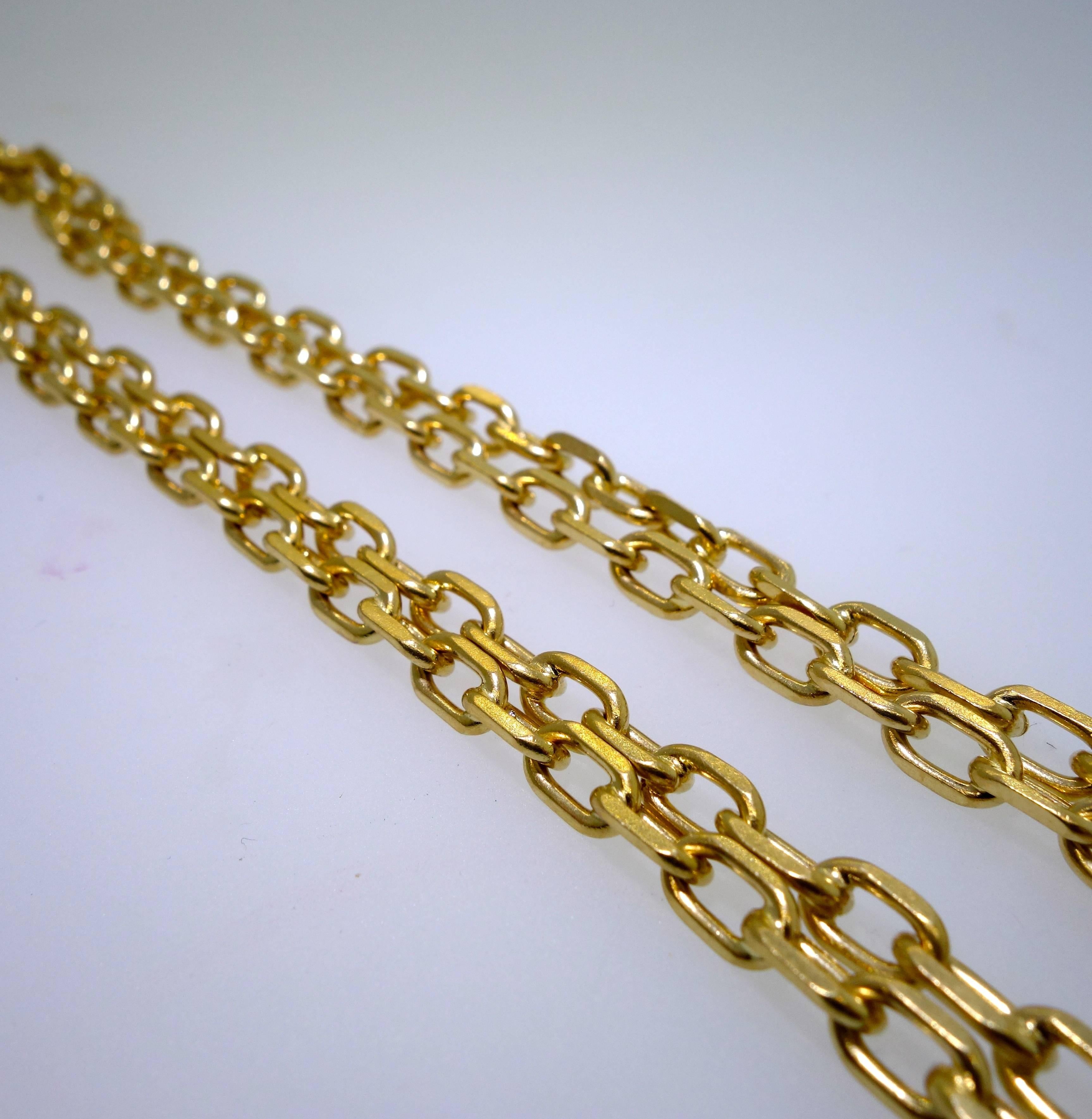 A gold long necklace chain that is 30 inches in length and weighs almost 51 grams.  
 