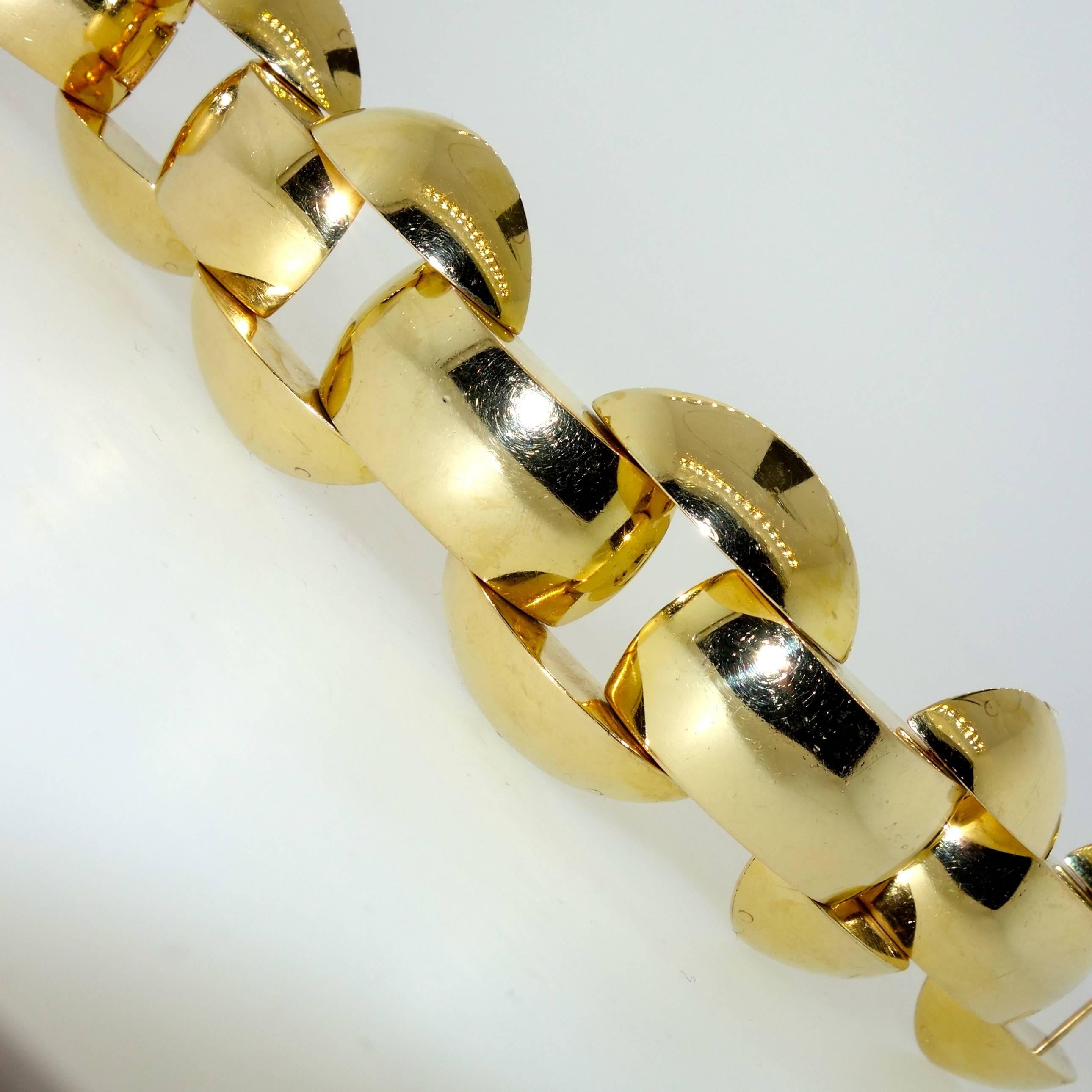 Bold gold bracelet, striking American retro design, this heavy link bracelet is 7.5 inches long, 1.5 inches wide and weighs 98.77 grams.