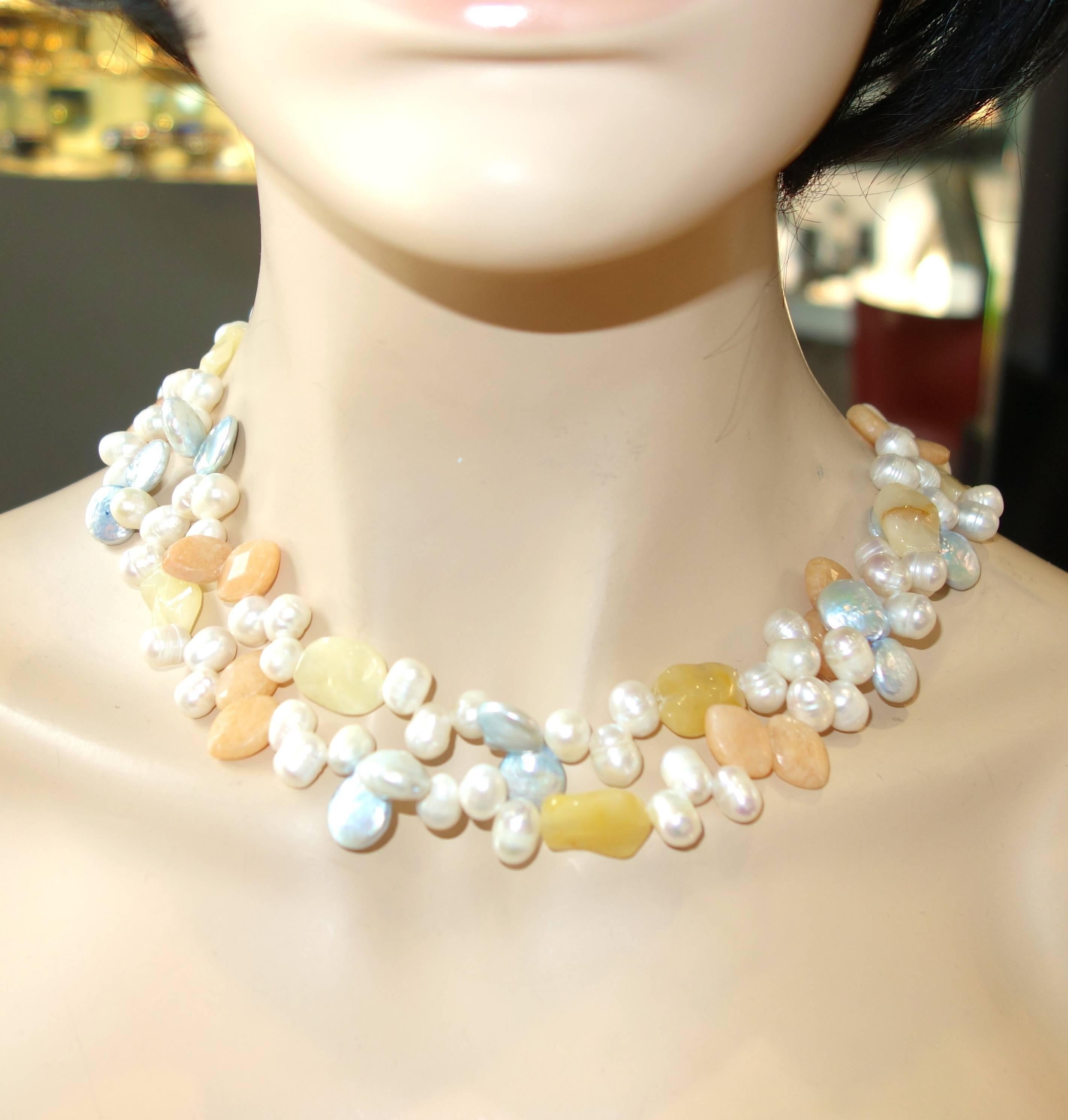 Multi color fresh water pearls strung with multi color, top faceted, agate long necklace terminating with tassles, this necklace can be "tied" and worn a number of different ways.