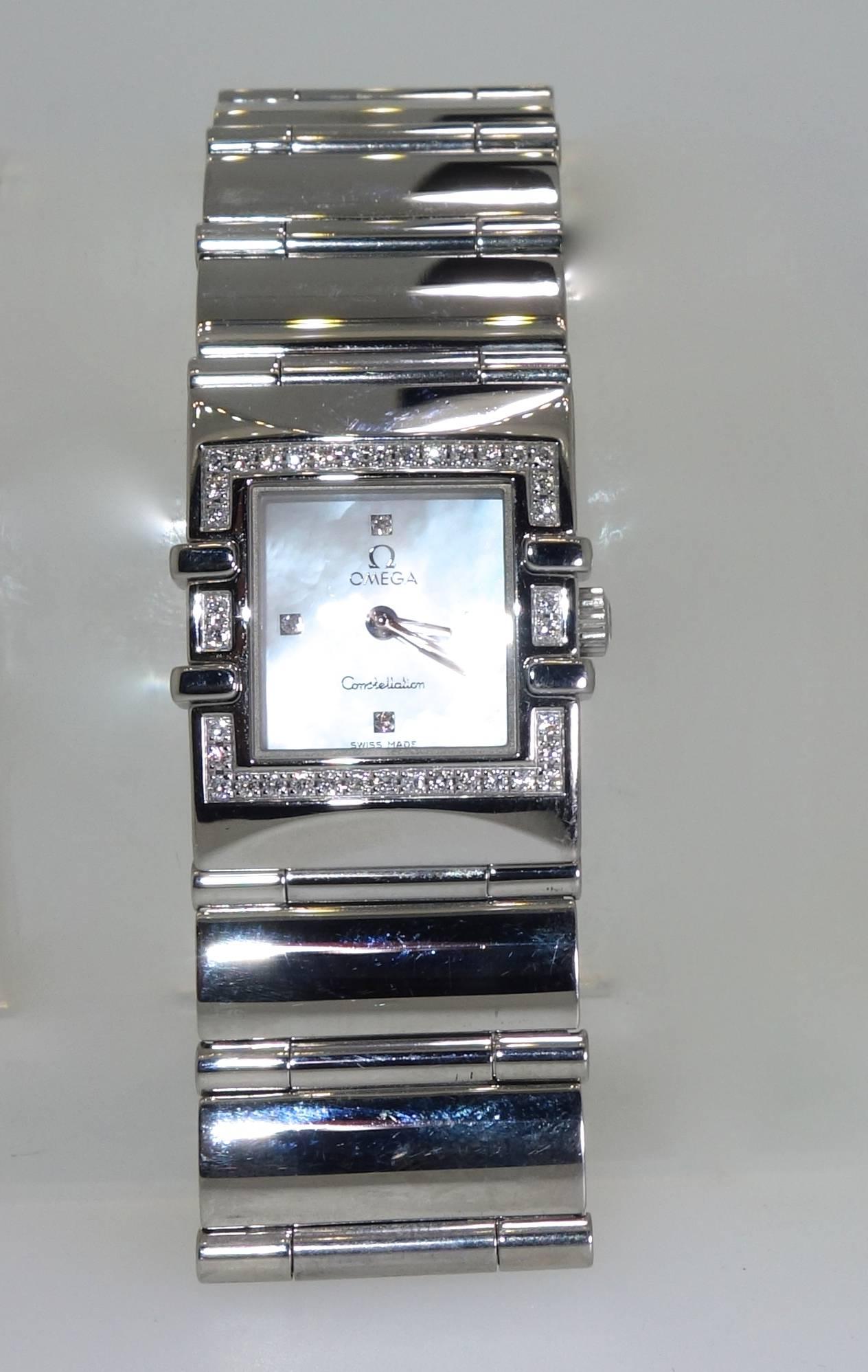 Omega Constellation square diamond and mother of pearl stainless steel new condition quartz wristwatch.  42 fine white diamonds enhance this all original signed and numbered wristwatch.  The back of the watch is numbered with Omega's hallmark and 